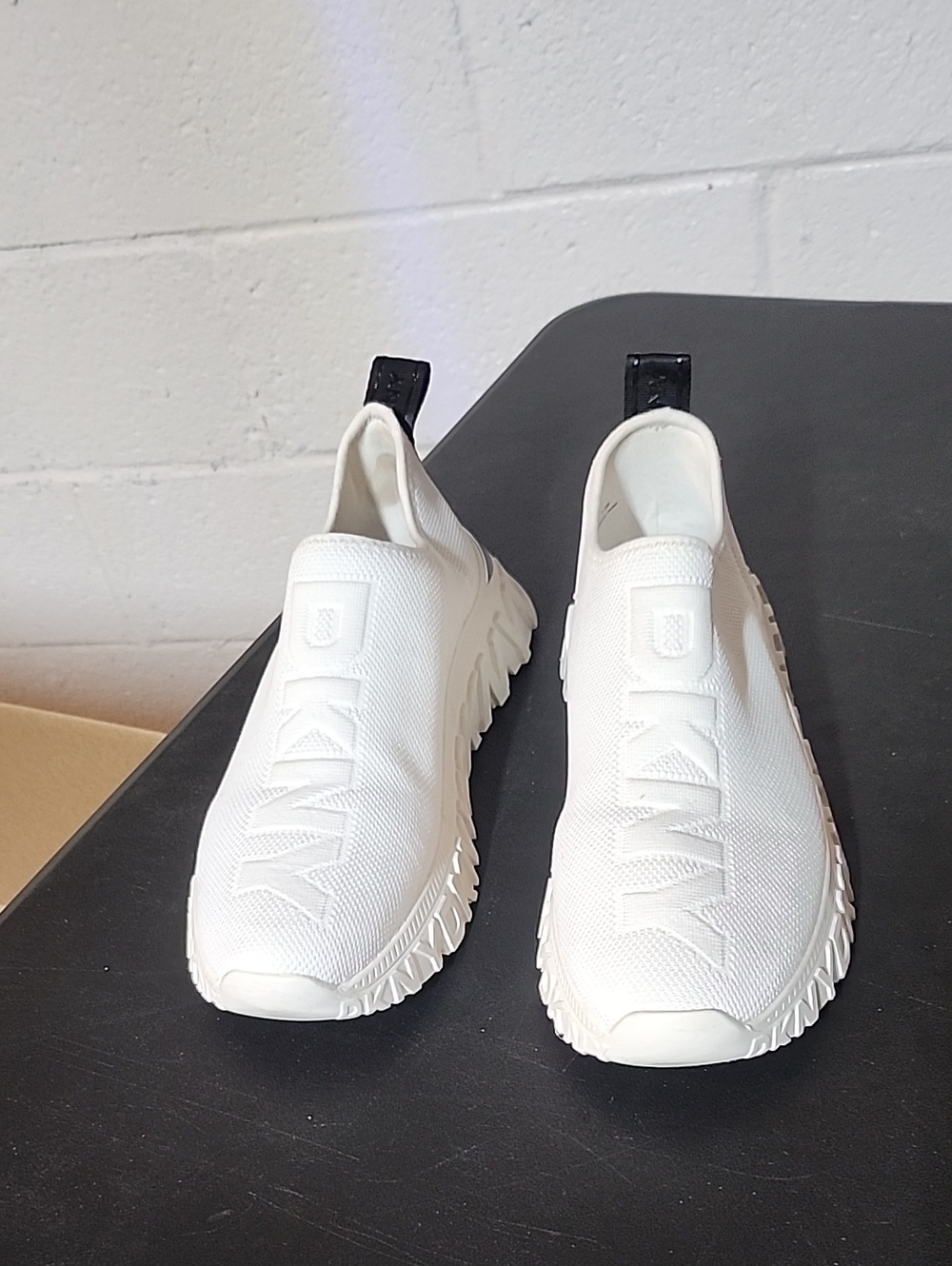 DKNY White Knit Slip-On Sneakers with Black Heel Tabs